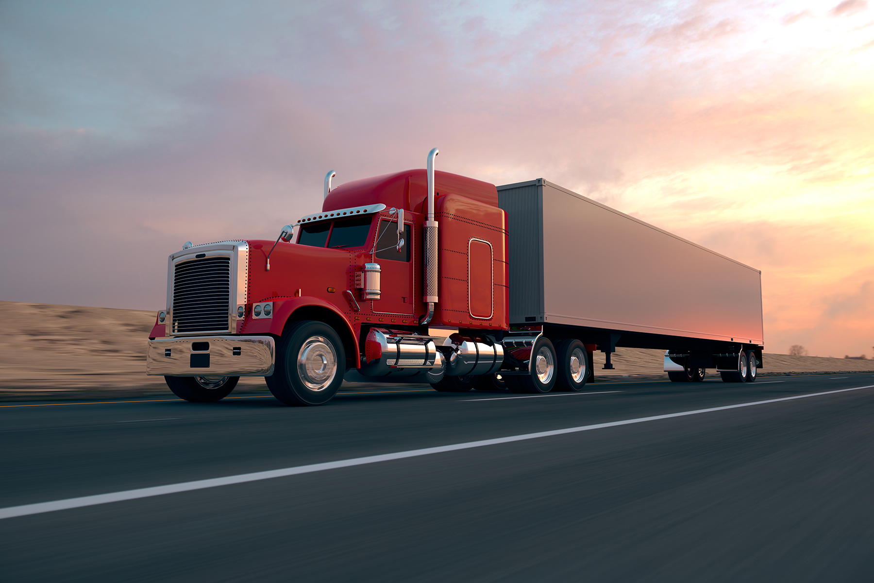 Transport Truck on a highway with the sunset in the background